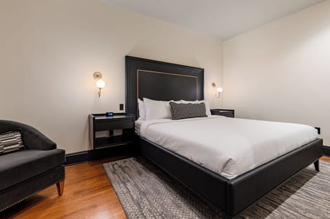 Bedroom 1 - King bed featuring a built-in wardrobe, flat-screen TV, and en-suite bathroom.