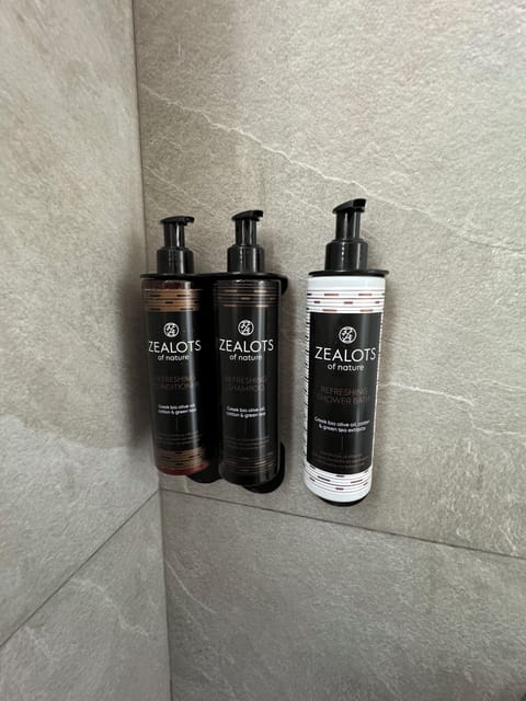 Shower, hair dryer, slippers, towels