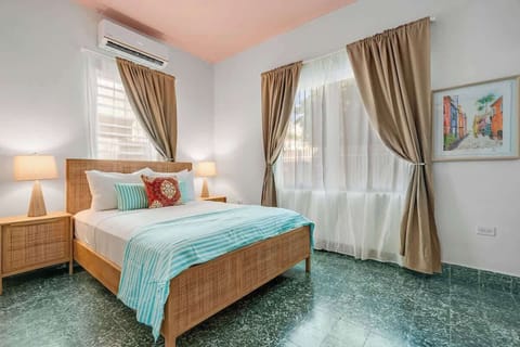 Bright and airy space featuring crisp linens and soft lighting for a restful night.