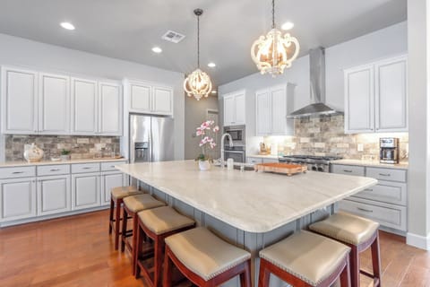 Modern chef kitchen with large island.