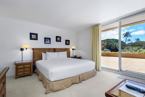 Wake up to swaying palms and lush hillsides framed by your private balcony. Sink into crisp linens and tropical serenity after your island adventures.