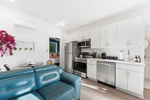 Fully Equipped Kitchen in a Tiny House: Enjoy the convenience of a modern kitchen, thoughtfully designed with all the essentials you need to cook with ease.