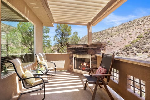 Private balcony on the 3rd floor with seating, BBQ, and fireplace!