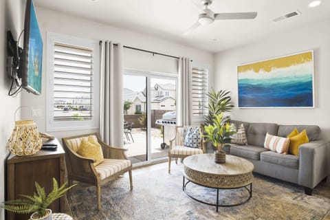 Cozy and spacious living area with TV