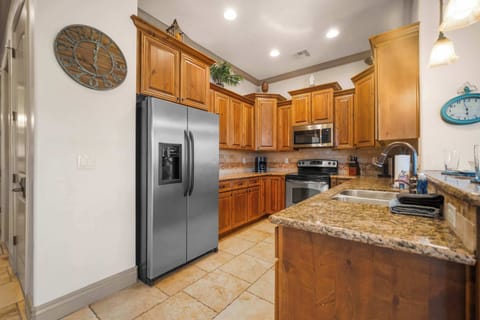 The warm, open kitchen offers ample space & every home comfort