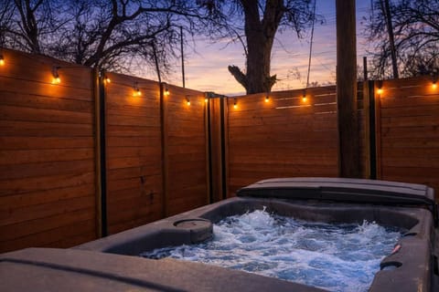 Relax beneath the stars in your secluded hot tub retreat.