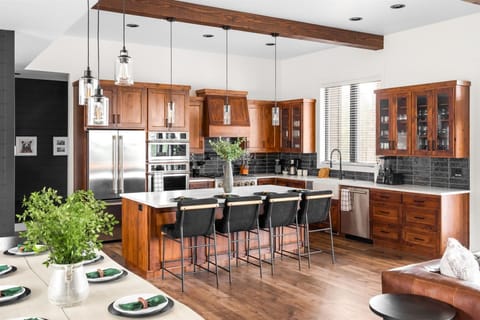 Cook in style with our fully stocked kitchen, featuring a spacious island with high seating for casual dining or socializing.