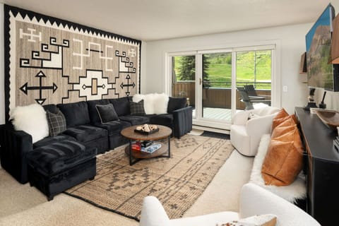 Sink into plush seating and soak in scenic mountain views. Your inviting living room blends modern comfort with natural beauty, creating the perfect retreat for relaxation and connection.