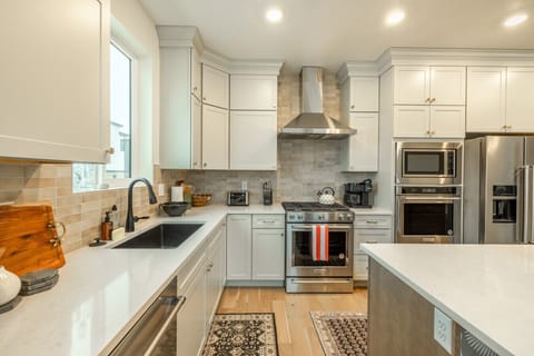 Bright and elegant kitchen with stainless steel appliances