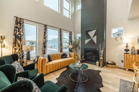 Stylish living space with high ceilings and vibrant seating