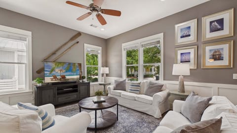 Living area with stylish furnishings that allow for ample seating. Sleeper sofa in the living area. TV included.