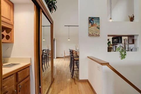 Your open-concept kitchen flows seamlessly into the dining area, where warm wood accents and vintage touches create an inviting atmosphere for memorable meals.