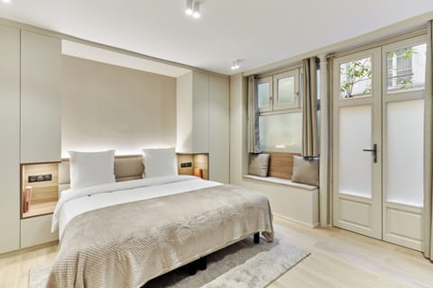 Apartment | Laptop workspace, iron/ironing board, bed sheets