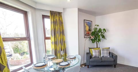 Relax in a bright and stylish living room with free parking right outside your door in Didsbury