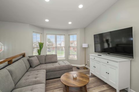 Curl up in the airy living room & stream your favorites on the smart TV