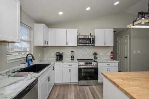 The open kitchen offers ample space & every home comfort