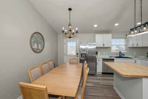 Gather for meals together at the dining table, offering seating for 8