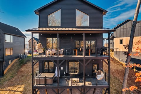 Two patios with a hot tub,firepit,alfresco dining, BBQ grill, conversation set!