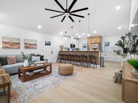 The pull-out sofa bed is ready for guests, while the open kitchen is perfect for entertaining. A home that`s both stylish and practical.