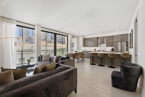 Family Apartment, 3 Bedrooms, Balcony | Living area | 55-inch Smart TV with digital channels