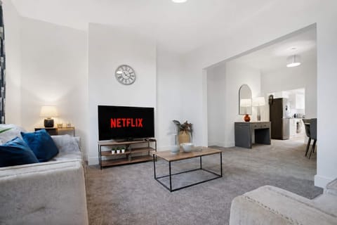 Unwind in the spacious living room, thoughtfully furnished with comfortable seating and a Smart TV for your entertainment. Whether you're watching your favourite shows or catching up with friends and family, it's the perfect place to relax.