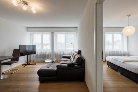 Deluxe Double Room | Living area | 22-inch flat-screen TV with cable channels