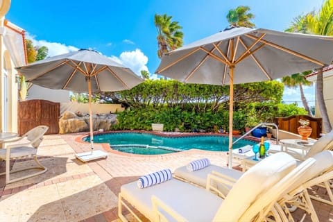 Unwind by the pool in your own lush, private tropical paradise.