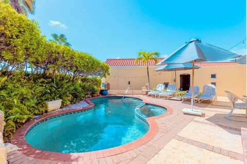 Your private oasis with a refreshing pool and relaxing outdoor lounge.