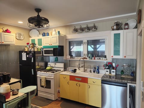 Bar with Concrete counter tops/toaster/cutting boards/Bar stools