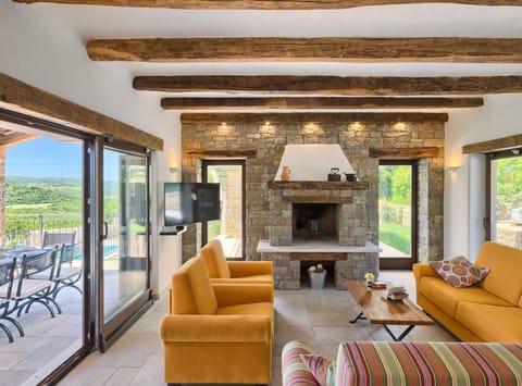 Villa (Four Bedroom Villa With Pool) | Living room | 32-inch flat-screen TV with satellite channels