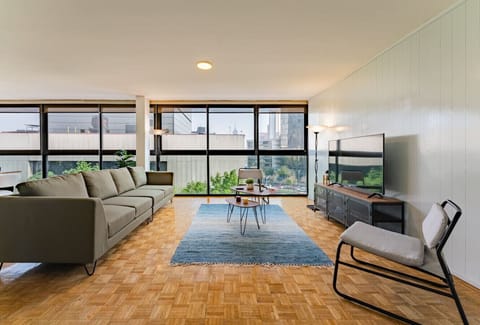 Relax in style in this comfy living room with panoramic views of Reforma.