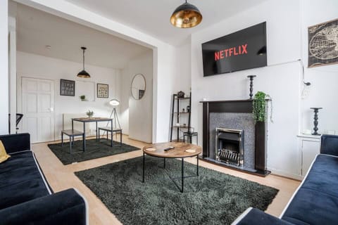 A bright and comfortable living space with spacious seating and a Smart TV with Netflix — the ideal spot to relax after the excitement of match day at Anfield Stadium, just a short walk away