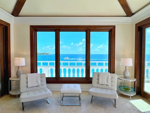 The living area seamlessly connects to outdoor spaces for breezy evenings.