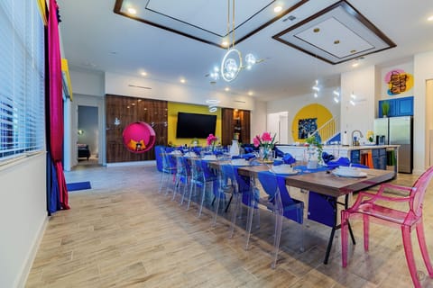 Dining seats large groups. Modern lights, bold decor, open design, celebrations.