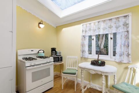 With a small table for quick coffee prep or breakfast and a large skylight for more light.