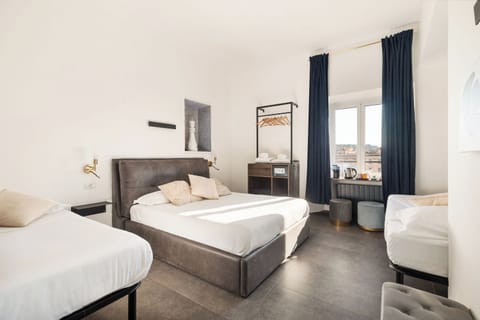 Quadruple Room, Private Bathroom, City View | In-room safe, blackout drapes, soundproofing, iron/ironing board