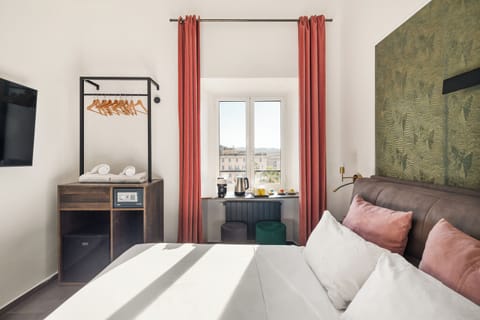 Triple Room, Private Bathroom, City View | In-room safe, blackout drapes, soundproofing, iron/ironing board