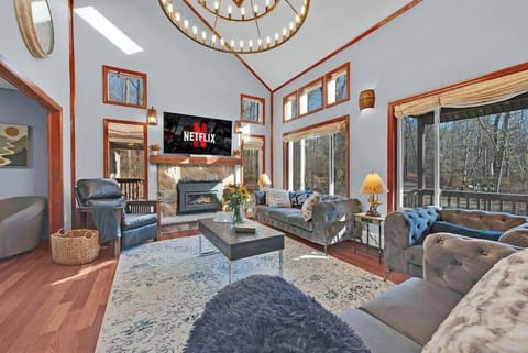 Cozy vibes and movie nights! Nothing beats curling up in this living room with a fireplace, comfy couches, and a Netflix binge session. 