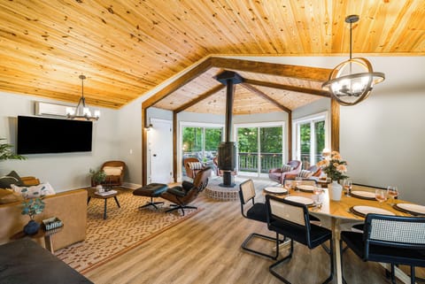 Gather for meals with natural light, treetop views, and a fireplace glow.