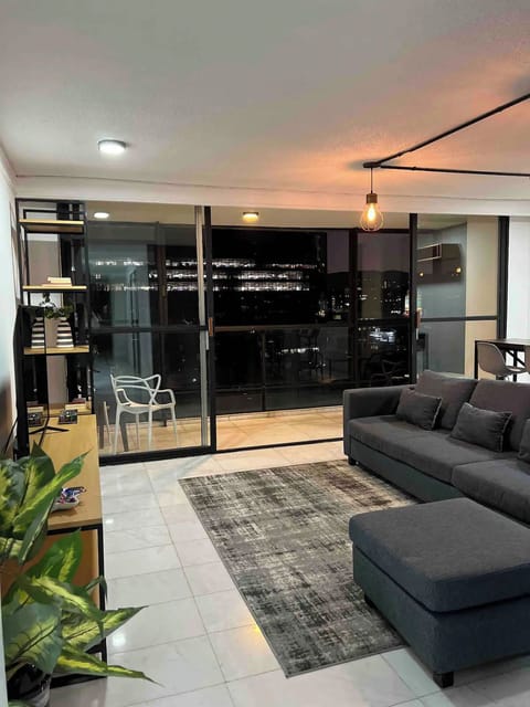 Apartment, Multiple Bedrooms, Balcony, City View | Living area | TV