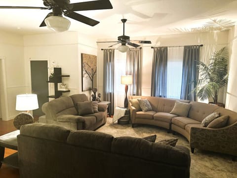High ceilings, soft lighting, and cozy couches — your go-to space for winding down.