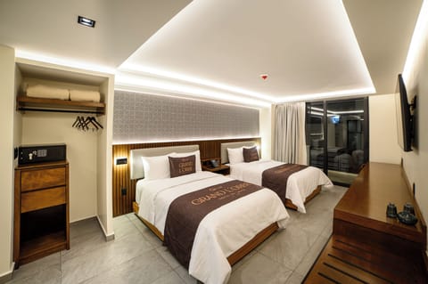 Deluxe Room, Balcony, City View | In-room safe, desk, laptop workspace, blackout drapes