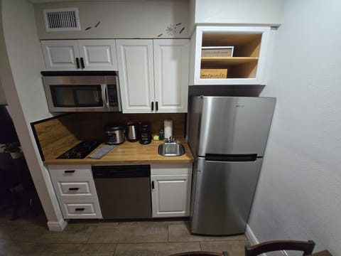 Fully stocked with the basics to whip up a home-style meal. Appliances: Coffee m