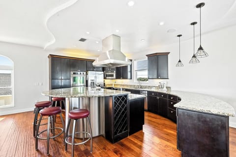 A fully equipped kitchen stocked with all your cooking essentials, perfect for preparing meals and gathering with family and friends.