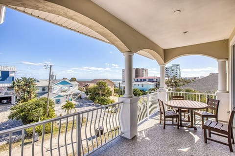 The third-floor balcony, accessible from the living room, offers stunning ocean views and a serene spot to relax and enjoy the coastal breeze.