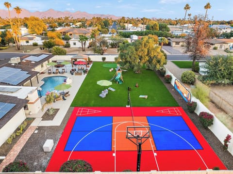 From above, our backyard is the ultimate retreat—featuring a private pool, sportscourt, and a variety of outdoor activities. 