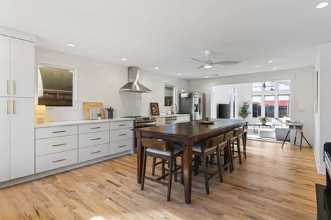 The kitchen is fully equipped with high-end appliances and all the cooking essentials you may need. Enjoy meals at the dining table.