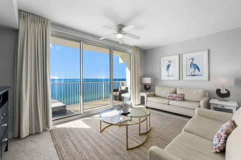 Relax in this modern living room with ocean views through large sliding glass doors.