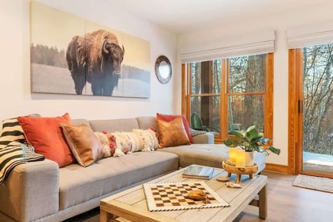 Enjoy the warm & cozy decor and large windows in the living room.