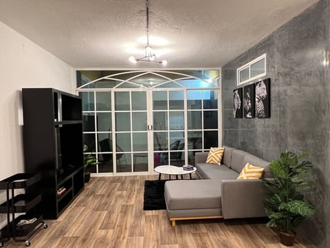 Apartment, 4 Bedrooms | Living area | TV